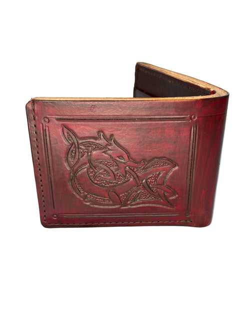 Burgundy leather bi-fold wallet with hand tooled design.